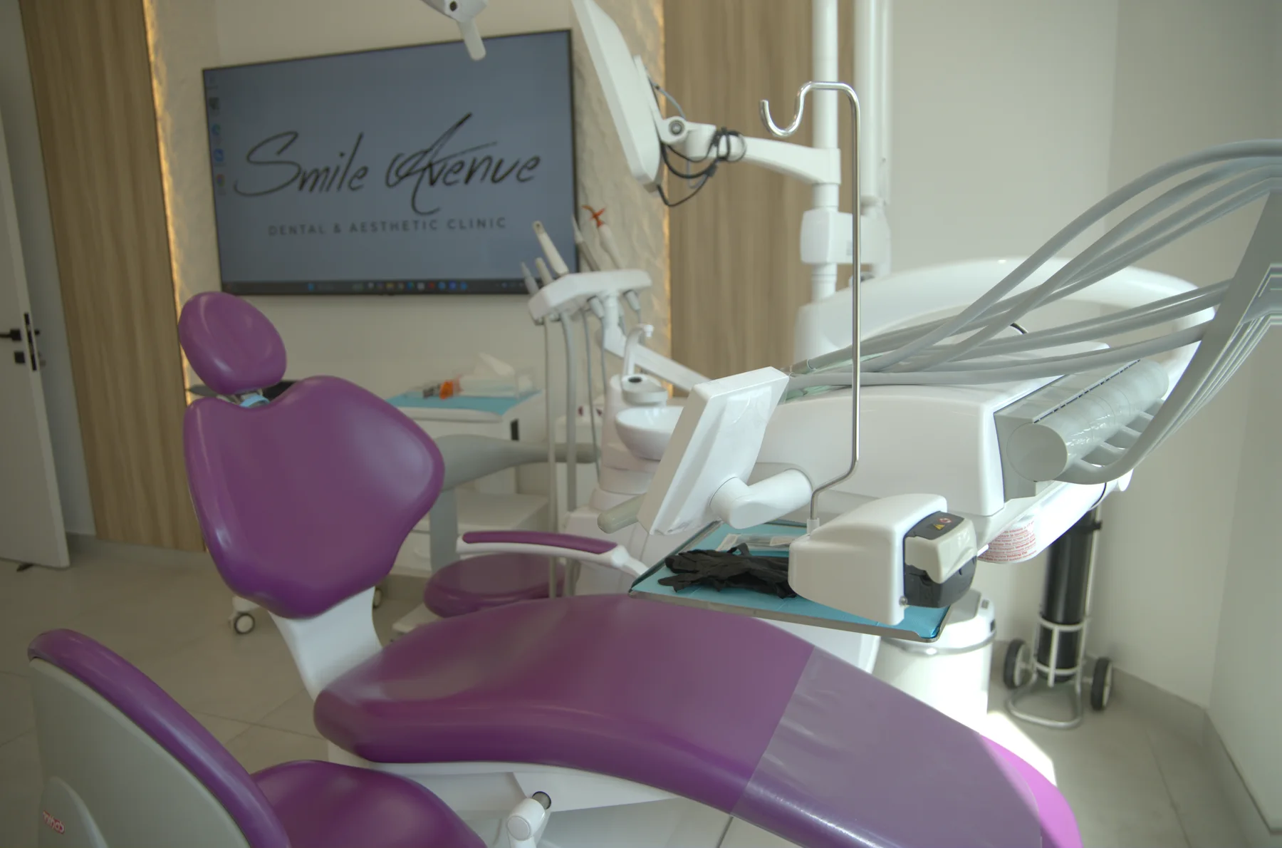 Pink dental treatment chair and modern equipment at Smile Avenue Dubai